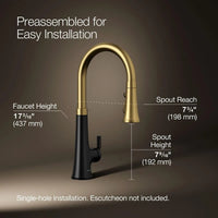 Gold and black faucet with measurements on a brown background