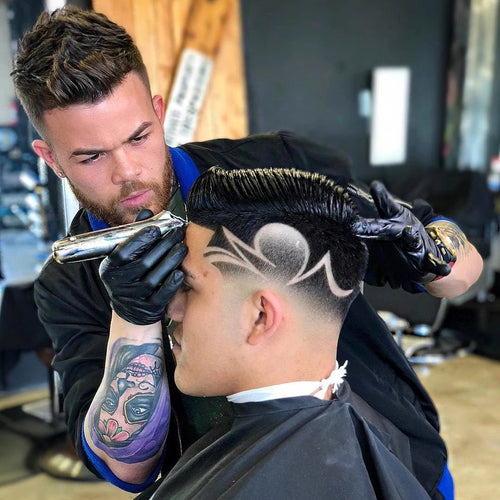 Barber working on a customer's hair using Andis 32810