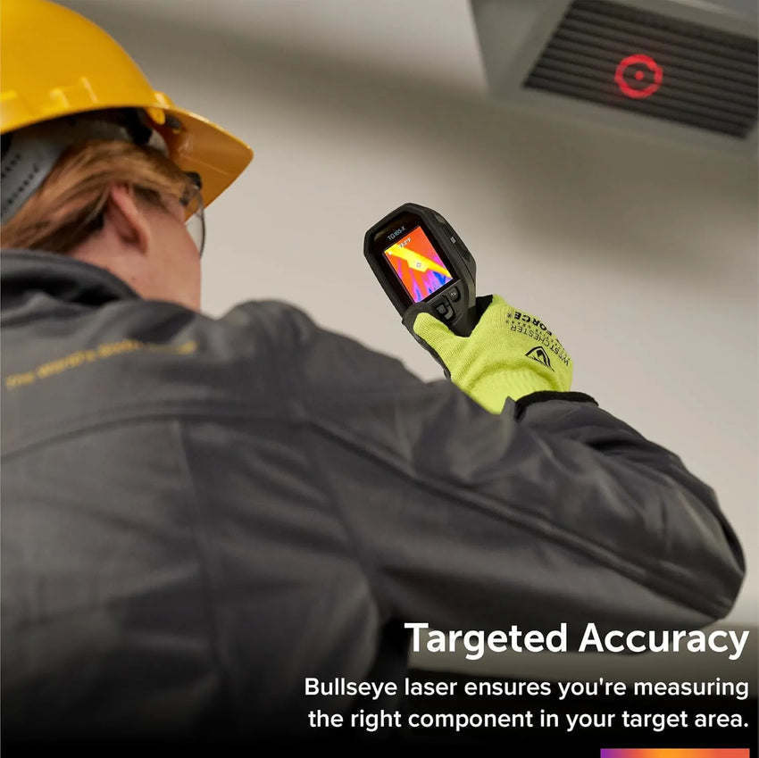 A man wearing a helmet and goggles using a thermal imaging device