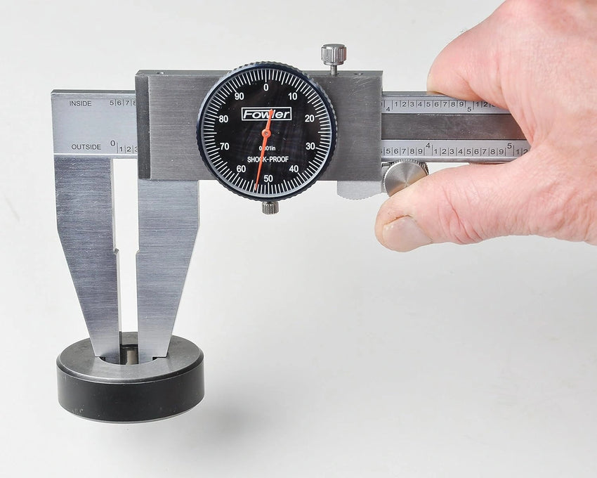 Caliper measuring tool on a white background