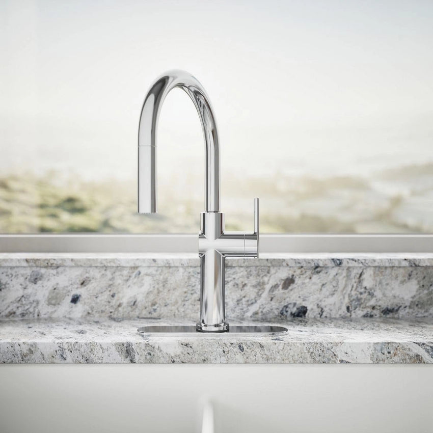 Modern kitchen faucet on a marble countertop with a neutral background