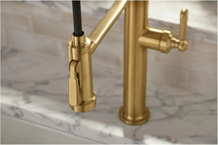 Kitchen faucet on a marble countertop