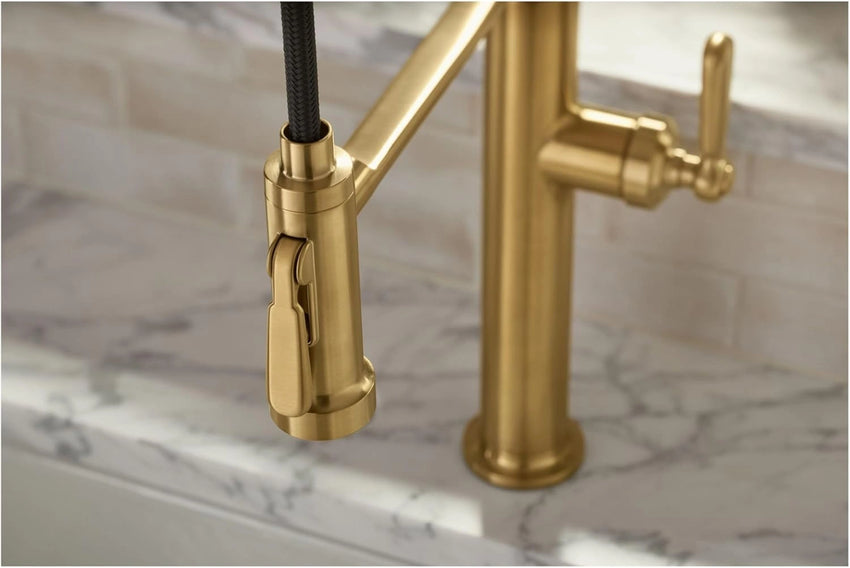 Kitchen faucet on a marble countertop