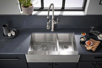 Stainless steel kitchen sink with modern faucet in a kitchen setting