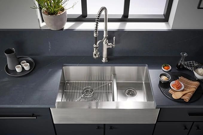 Stainless steel kitchen sink with modern faucet in a kitchen setting