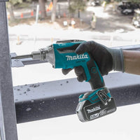 Makita power drill being used on a construction site