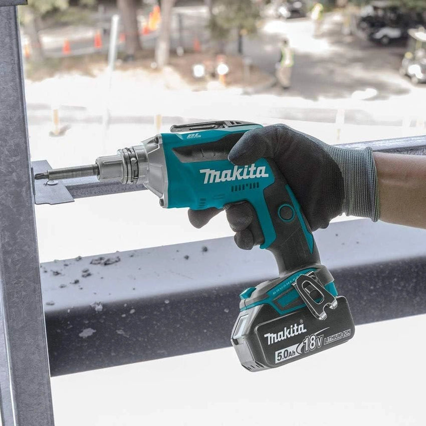 Makita power drill being used on a construction site