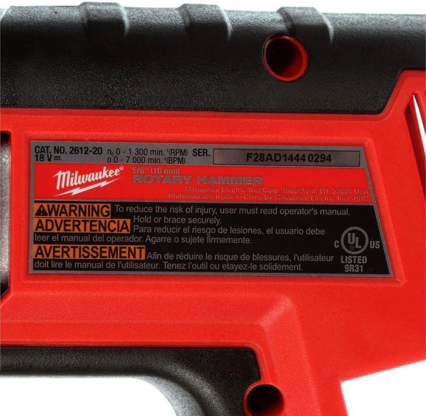 Red Milwaukee Rotary Hammer with warning label on a white background
