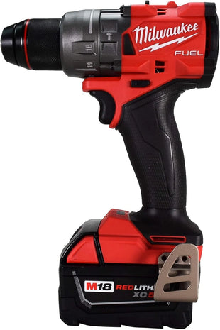 Red and black Milwaukee power drill on a white background